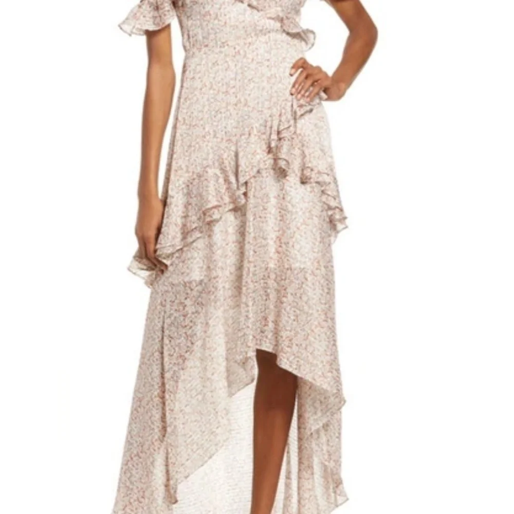 Floret Studios Asymmetrical Ruffle Dress in Cream Floral
NWOT - Picture 6 of 6